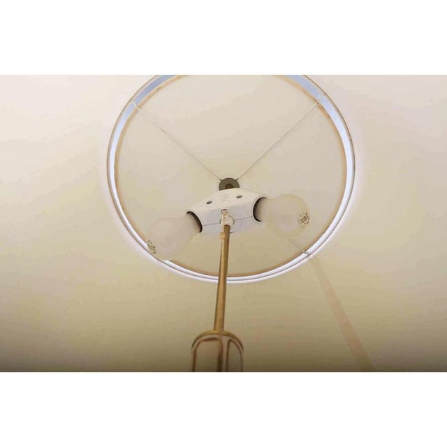Heavy polished brass leg. Modern lampshade. The lamp is for two bulbs with a classic E27 thread (classic and LED bulbs are...