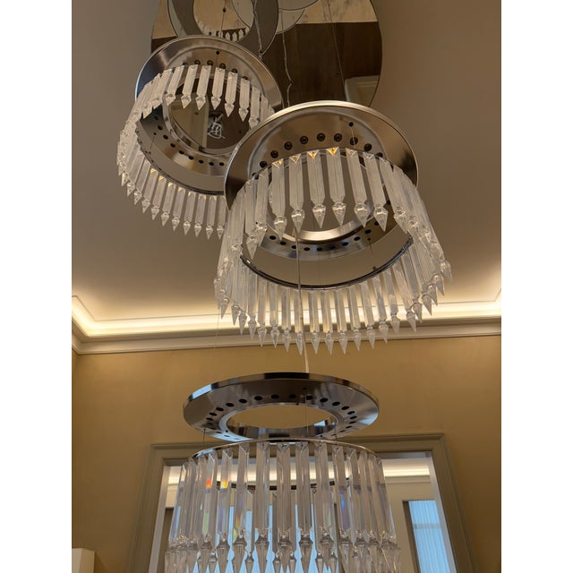 Add timeless elegance and French craftsmanship to your space with this Baccarat Lady Crinoline Chandelier. Featuring three...