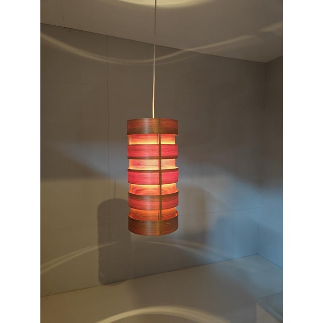 Bring warm Scandinavian warmth into your space with this stunning Mid-Century Modern pendant lamp. Designed by the...
