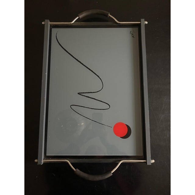 Designer tray produced by Axis Paris in the 1980s. Metal and wood frame, painted glass top. Adjustable handles This piece...