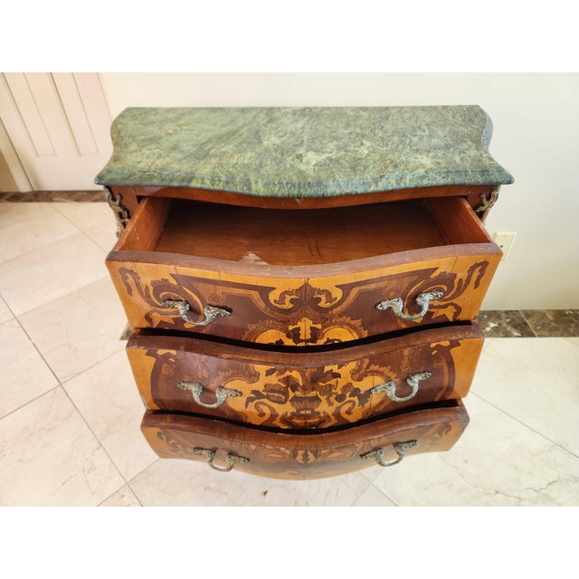 Introduce a touch of timeless French elegance to your space with this exquisite Louis XV style commode. Crafted with...