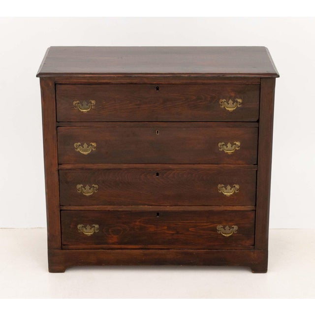 Chippendale Style Mahogany Chest of Drawers, four drawers with eight brass pulls. 35.5" H x 38.25" W x 17" D. Provenance:...
