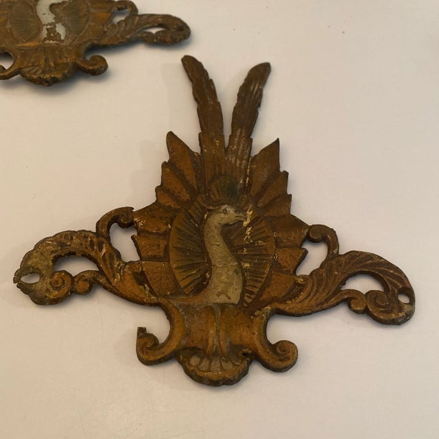 Antique adornments of peacocks Antique hardware with holes to attach to furniture or whatever you desire. I do not know...