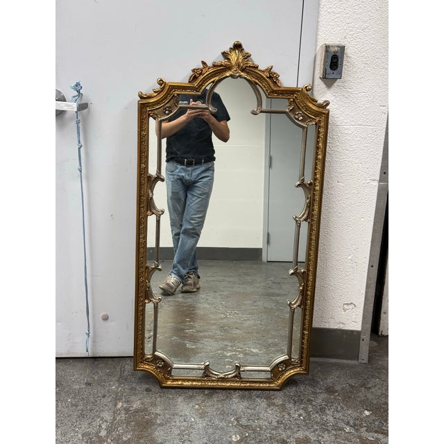 Design Plus Gallery presents a Vintage Louis XV Style Gilt Baroque Wall Mirror. This ornate mirror showcases an elaborate...
