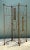 This vintage iron folding screen brings sculptural, mid-century modern character to any room with its abstract figurative...
