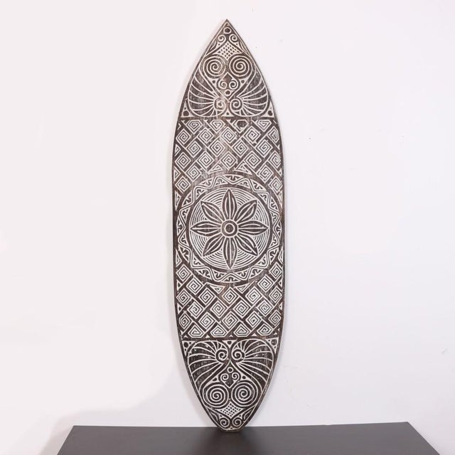 Hand-Carved Mahogany Surfboard Wall Decor The Hand-Carved Mahogany Surfboard Wall Decor is a stunning artisanal piece,...