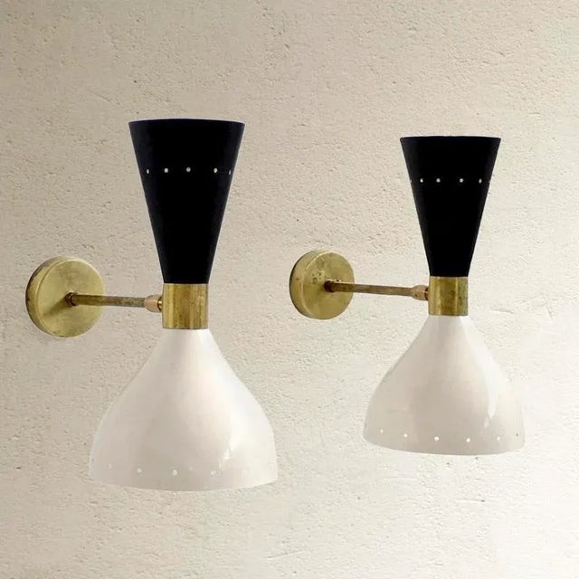 Dimensions: 28h x 15w x 31d cm pair of wall lights in aluminium and brass, adjustable with double point of light. uses e14...