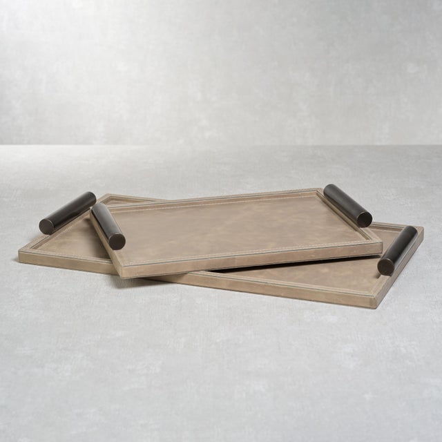 A twist to a traditional tray, this sophisticated Cameroon Mink Leather Serving Tray is a well-made piece that will last...