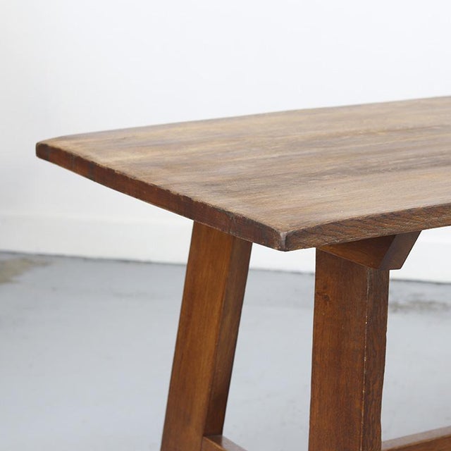 Vintage Brutalist dining table made of solid oak, crafted in the traditional manner. A robust and distinctive design with...