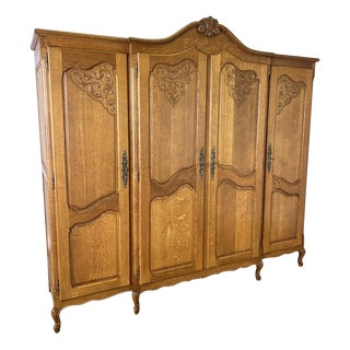 Vintage French Louis XVI Oak Four Door Carved Armoire For Sale