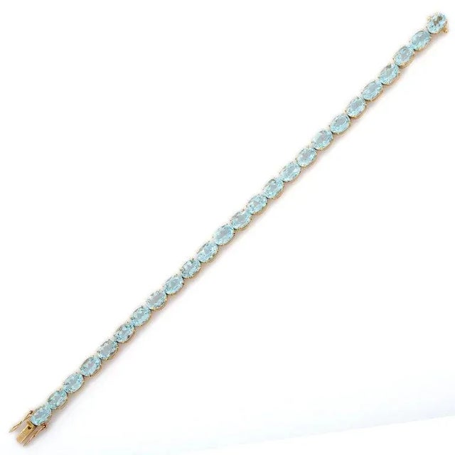 Metal 28.5 Carats Blue Topaz Gemstone Tennis Bracelet in 18k Yellow Gold For Sale - Image 7 of 17
