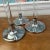 Listing is for a graduated set of 3 acrylic or lucite silver metal candlestick holders. The tallest is 20”, medium is 16”,...