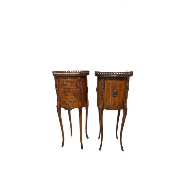 refined pair of French bedside tables in the Louis XV taste, also well-suited as elegant guéridon stands, dating to the...