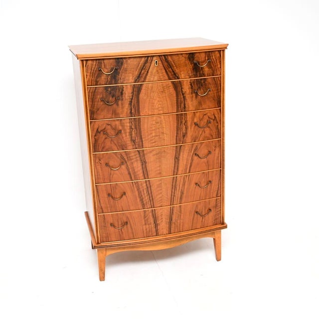 A stunning Danish vintage walnut and brass chest of drawers. This was made in Denmark, it dates from the 1960’s. It is of...