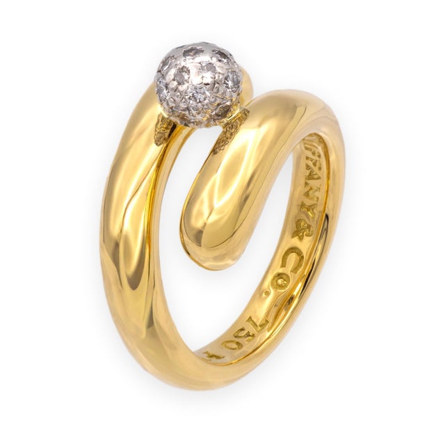 Vintage Tiffany & Co. bypass coil ring in 18K yellow gold and platinum, featuring a double-wrap polished gold band with a...
