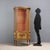 Neoclassical-style display cabinet in carved, lacquered, and gilded wood. The central door and curved sides feature...