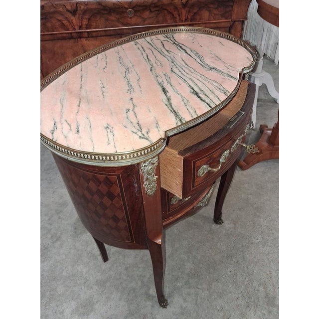 Louis XV Style Kidney-Shaped Commode in Marquetry with Pink Marble Top and Bronze Details, in Good conditions. Designed...