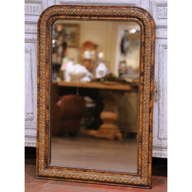 This elegant antique French Louis Philippe mirror, crafted circa 1870, showcases a richly decorative faux tortoiseshell...