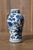 A charming antique Chinese porcelain snuff vase dating to the second half of the 19th century, during the Qing dynasty....