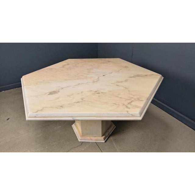 Beautiful dining table made from marble with a gorgeous natural pattern/vaining Very nice colours going between...