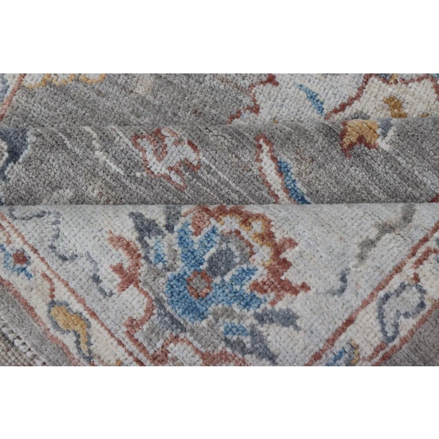 Floral Designed Oushak With Muted Background With Earthy Tones and Soft Blue For Sale - Image 11 of 13