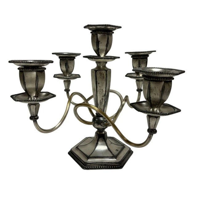 Enhance your space with the timeless elegance of this vintage "Rogers" Silver Plate Candelabra set, a captivating blend of...