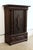 A late 17th century Swedish barque wardrobe or salon cabinet. Monumental in scale with an ebonized finish and brass...