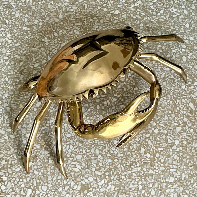 Elevate your coastal decor with the Vintage Coastal Monumental Polished Brass Crab. This striking piece, crafted from...