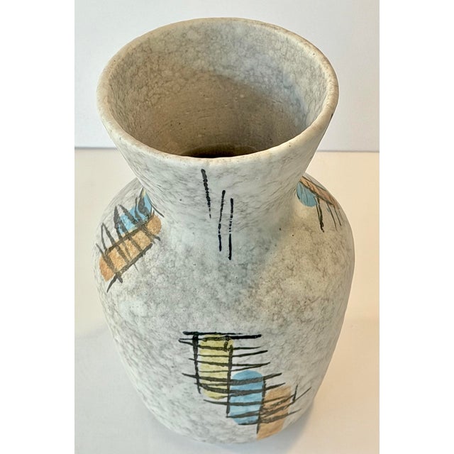 This mid-century modern hand painted West German vase was made by a company called Bay Keramics. It is a smaller but extra...