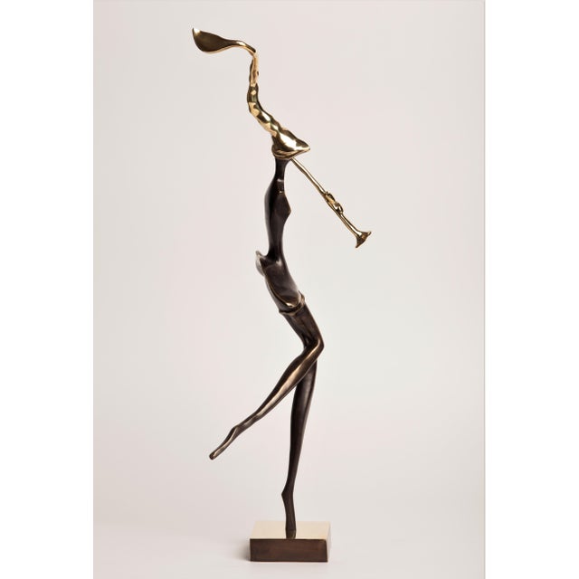 A contemporary figurative bronze of a woman playing a trumpet, her body elongated into a single tall, swaying line and...