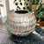Elevate your home decor with this Decorative Silver Metal Artichoke Leaf Vase, a stunning centerpiece that combines...