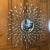Large starburst mirror with approximately over 100 tear drop shaped mirrors/faux crystals