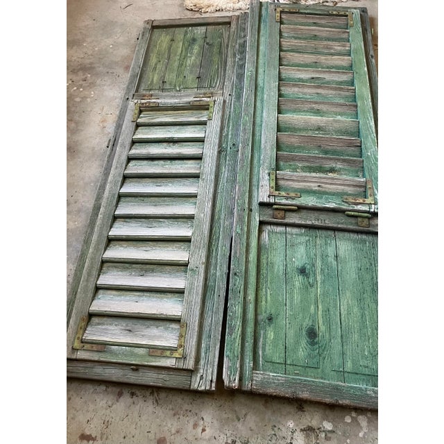 A pair of ;ate 19th Century French Doors. These doors were originally painted a typical shade of green very reminiscent...