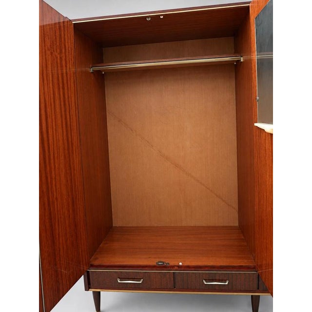 Large vintage design wardrobe from the 1950s. This large vintage design wardrobe from the 1950s is a real eye-catcher for...