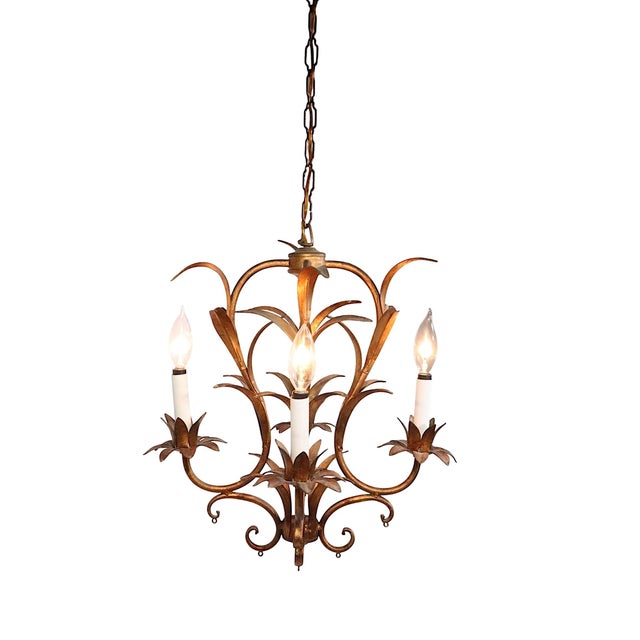 Charming four light gilt metal foliate chandelier, made in Italy, circa 1940/60's. This fixture is in very good, clean,...