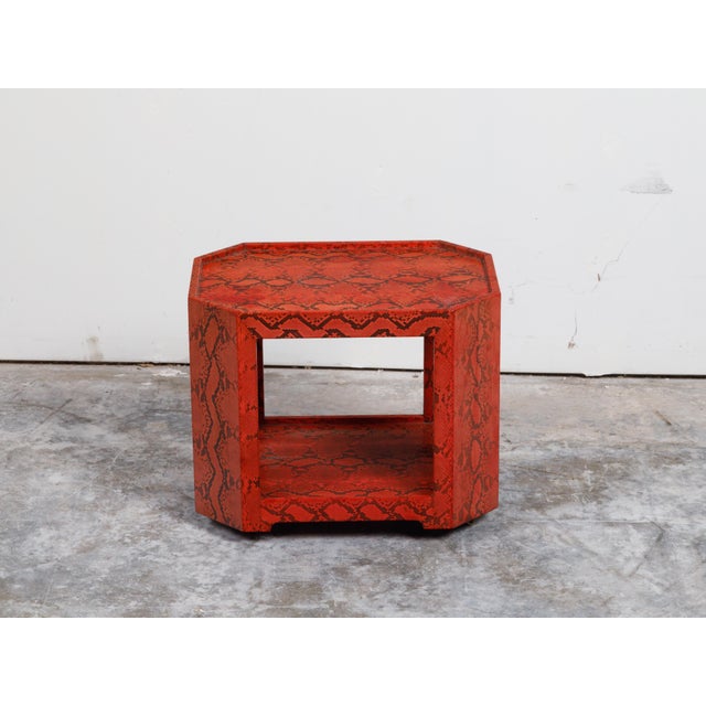 An octagonal bar cart from the mid 20th century attributed to Karl Springer, with red snakeskin and casters. Made by...