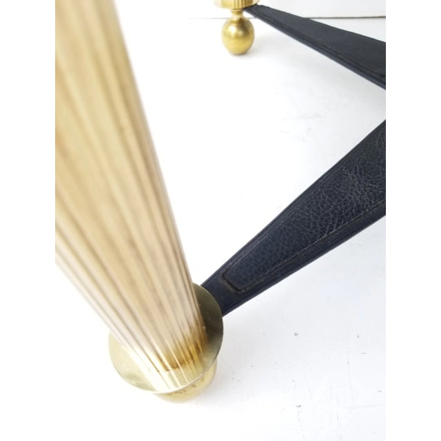 Unusual and rare Jacques Adnet style clock side table. Swiss clock mechanism.