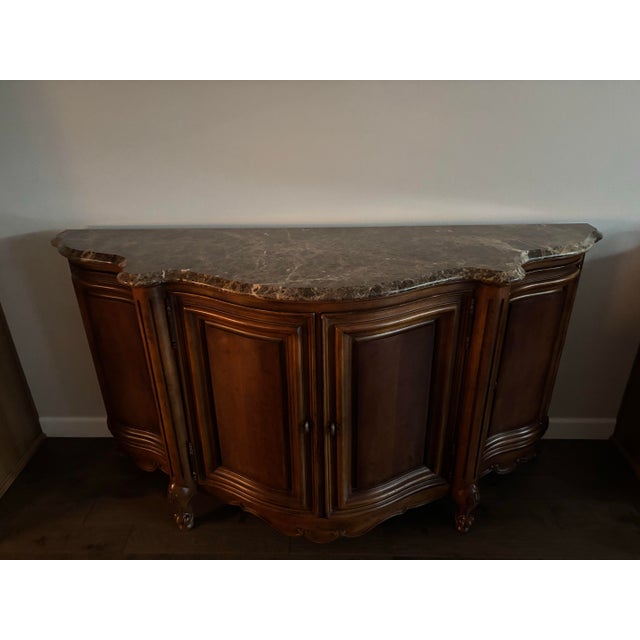 Add timeless charm to your space with this beautifully crafted cherrywood cabinet. Featuring a gracefully curved front and...