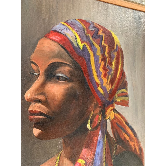 Beautiful Woman with colorful head wrap and jewelry very popular style in the mid 20th century. Strong features and...