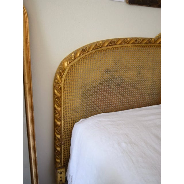 About the size of a queen. A custom mattress will be needed. The wooden frame is hand-carved and painted gold. There is a...