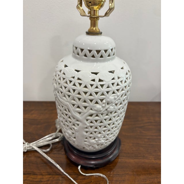 Vintage blanc de chine pierced Chinese export lamp with cherry branch motif. Recently rewired. Excellent condition. Height...