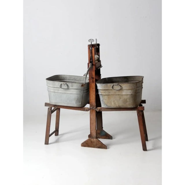 A rare and highly decorative early 20th-century folding washstand featuring the patented Bluegrass ball bearing wringer by...