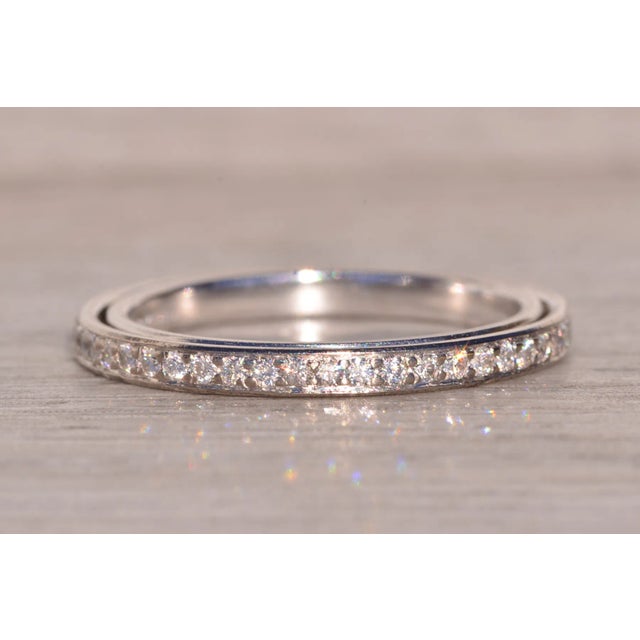 The Continuum Steller: Designer Signed Eternity Band with Natural Diamonds. This exquisite band showcases a total of 0.42...