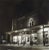 Pair of late 20th century black and white photographs of downtown Greune Texas at night by Eric C. Weller (20th century)...