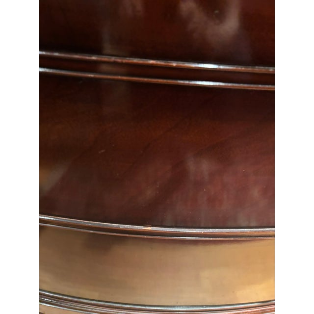 This is a mahogany bowfront dresser made by Drexel Furniture Company. The dresser has a glass cover. The glass was removed...