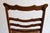 A classic hand crafted rocking chair with ornate three tiered back. No arms. Smooth in great condition. Seat is in very...