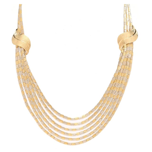 Absolutely magnificent 18K yellow and white gold multi-strand necklace. Stamped with numerous hallmarks for 18K gold,...