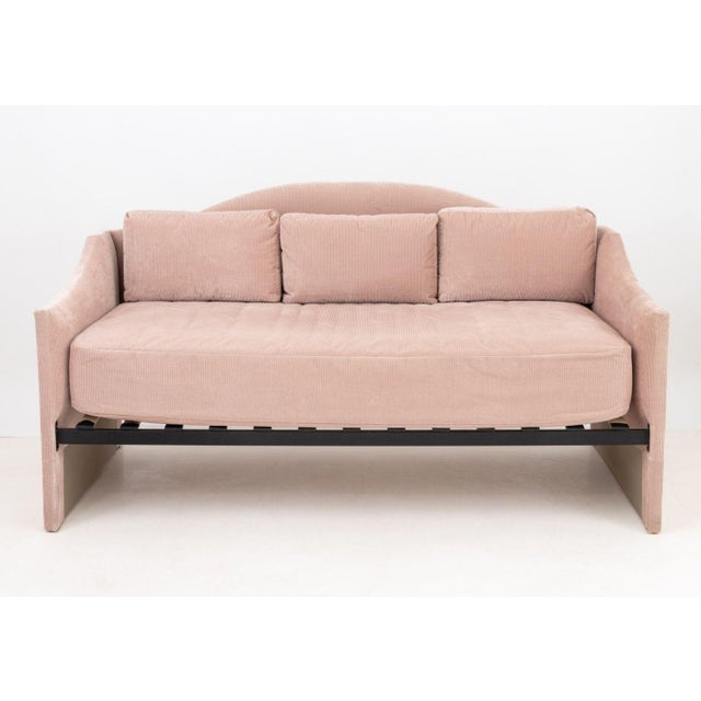 Blush Pink Ribbed Velvet Upholstered Daybed, with three throw pillows. 44" H x 83" W x 45" D; seat: 25.75" H. Provenance:...