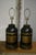 Vintage chinoiserie style black and gold tole lamps. Each lamp is marked: "Rudduck & Compy. Complete shop fitters for all...