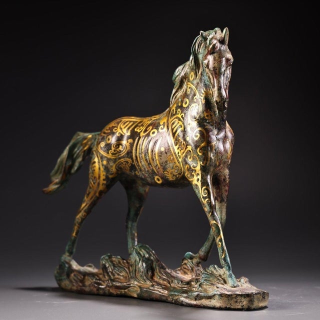 Exquisite hand-cast bronze horse sculpture featuring traditional Chinese cuojin (gold inlay) craftsmanship. The horse is...